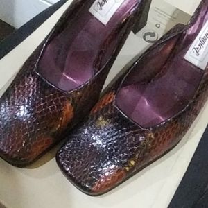 Brand new. Python/snake heels